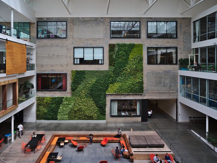 Bright multi-level atrium inside Airbnb's headquarters at 888 Brannan Street in San Francisco