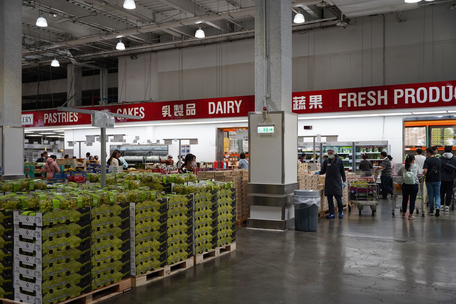 Wide aisles and tall pallet shelving inside a Costco warehouse in Kaohsiung, Taiwan